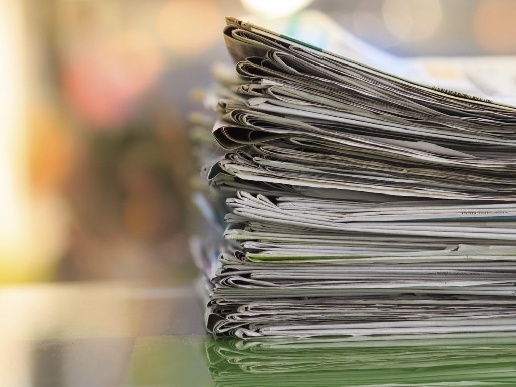 Pile of newspapers with space 000049900562 Large