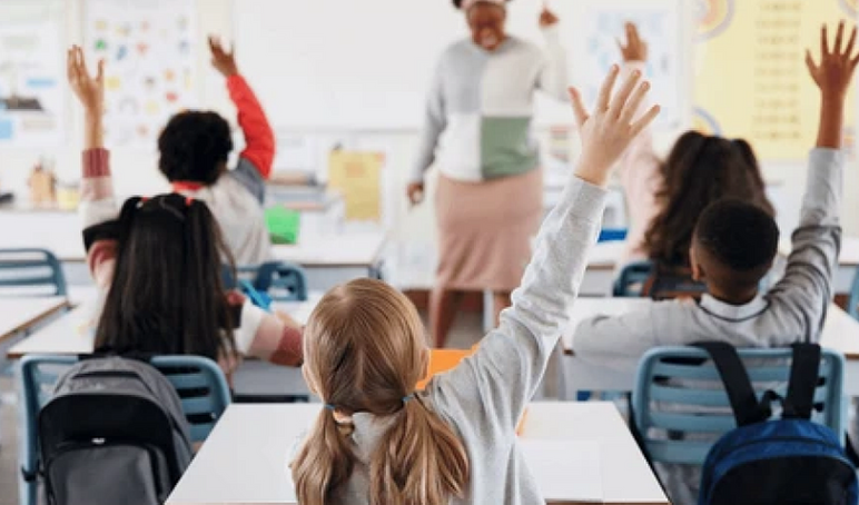Children raising their hands