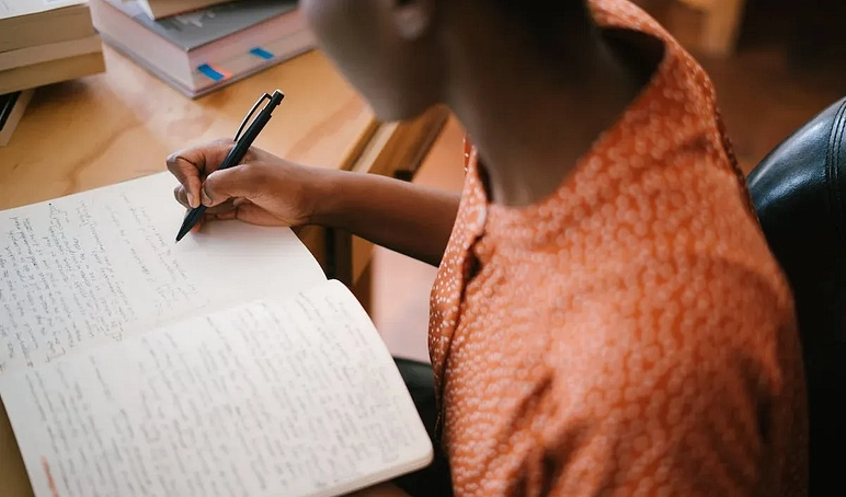 Diverse girl writing